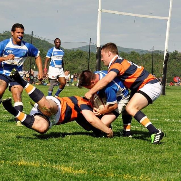 Men playing rugby at the annual Cam-Am Rugby near Peaks Resort
