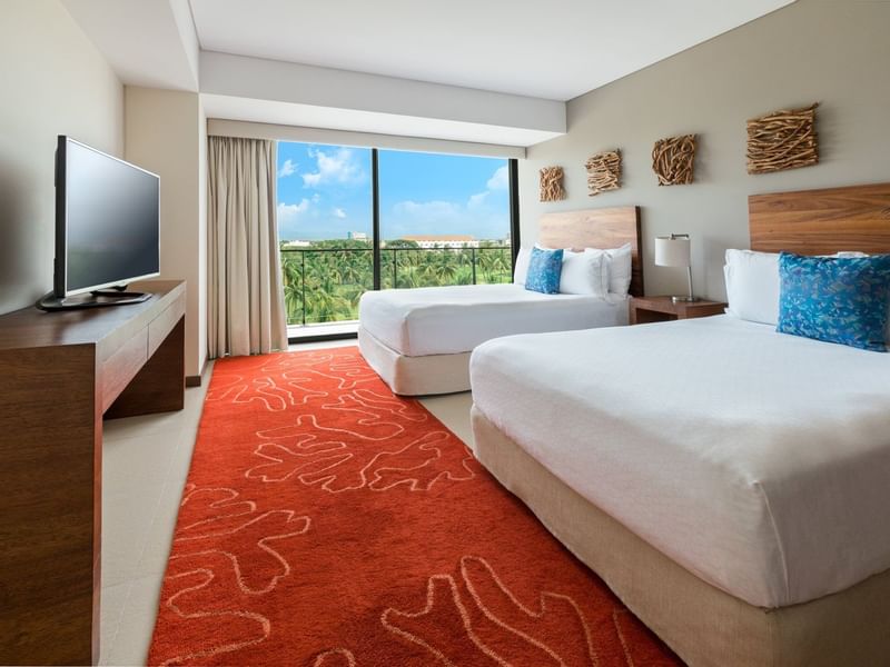 Twin bed and TV with a view in Club Condo at Live Aqua Private Residences Marina Vallarta