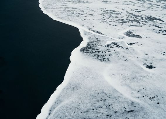 Close-up of waves on beach near The Rockaway Hotel