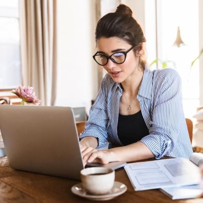 Women working from home featuring our article on 