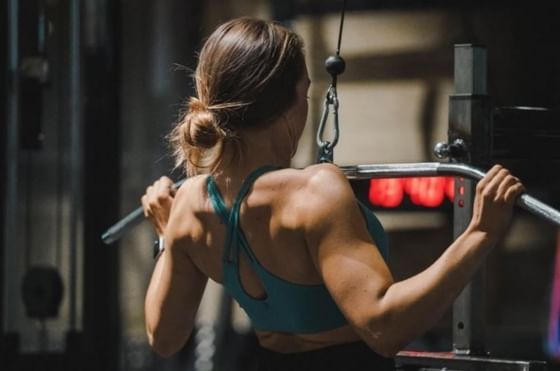 Reasons to Join a Gym featuring pull down weights bar