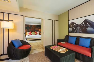 Living room area with comfortable sofa at U Hotels & Resorts