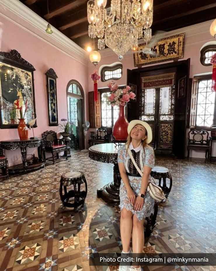 A lady was taking pictures inside the Pinang Peranakan Mansion - Lexis Suites Penang