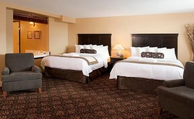 Loungers by the beds in Deluxe Spa Suite With Balcony at Temple Gardens Hotel & Spa