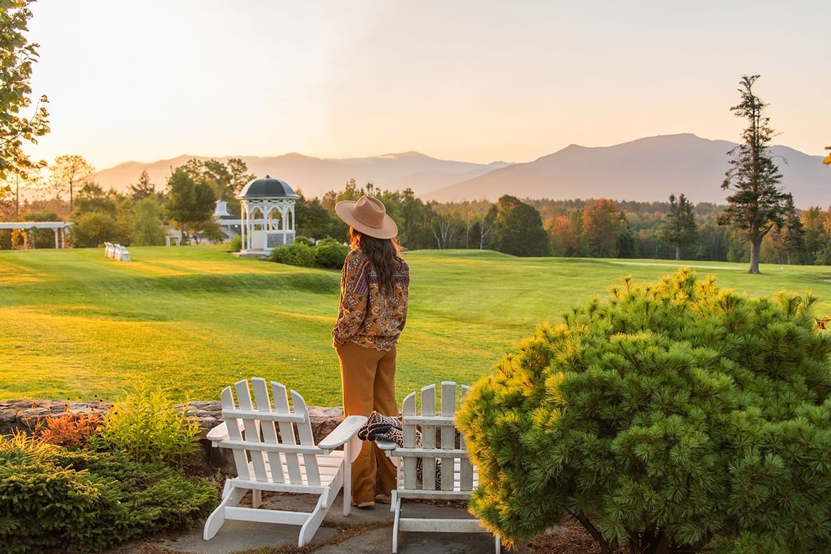 A woman with the serene landscape of a golf course near Mountain View Grand Resort & Spa