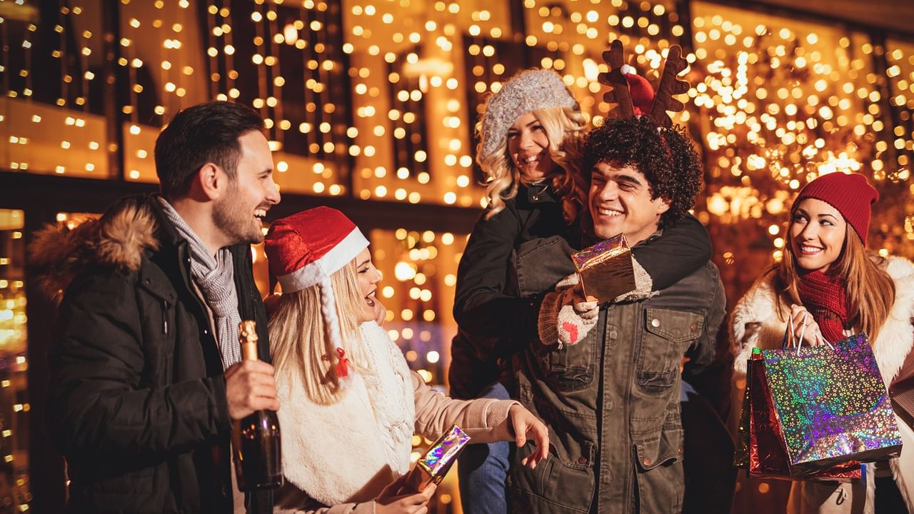 Friends laughing during a holiday celebration