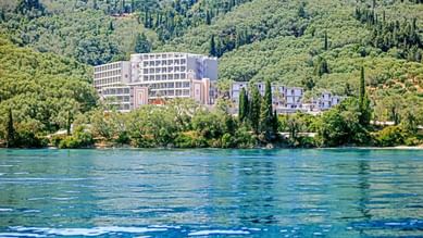 A distant exterior view of  Kairaba Mythos Palace with mountain
