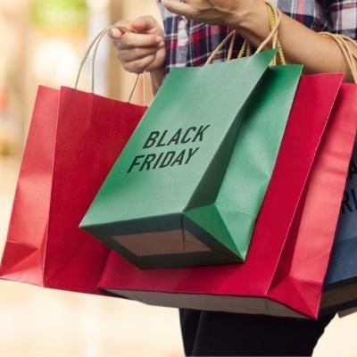 lady holding black friday shopping bags 
