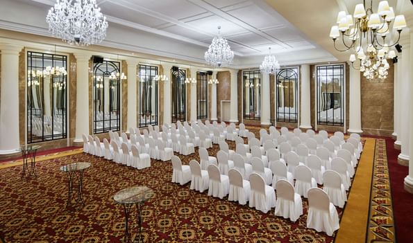 Row of chairs arranged in ballroom at the Titanic Gendarmenmarkt Berlin