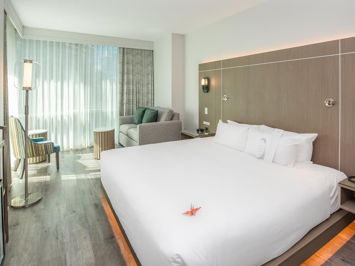 Spacious hotel room with a large bed.