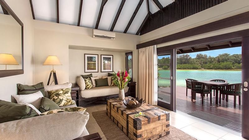 Lounge area overlooking the terrace in Pacific Pool Villa at Warwick Le Lagon