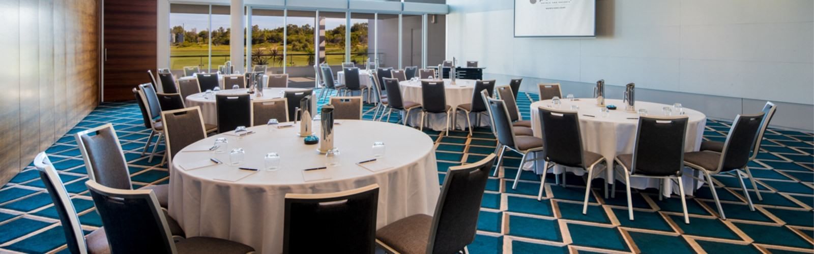 Conference room overlooking golf and lake at Pullman Magenta Shores