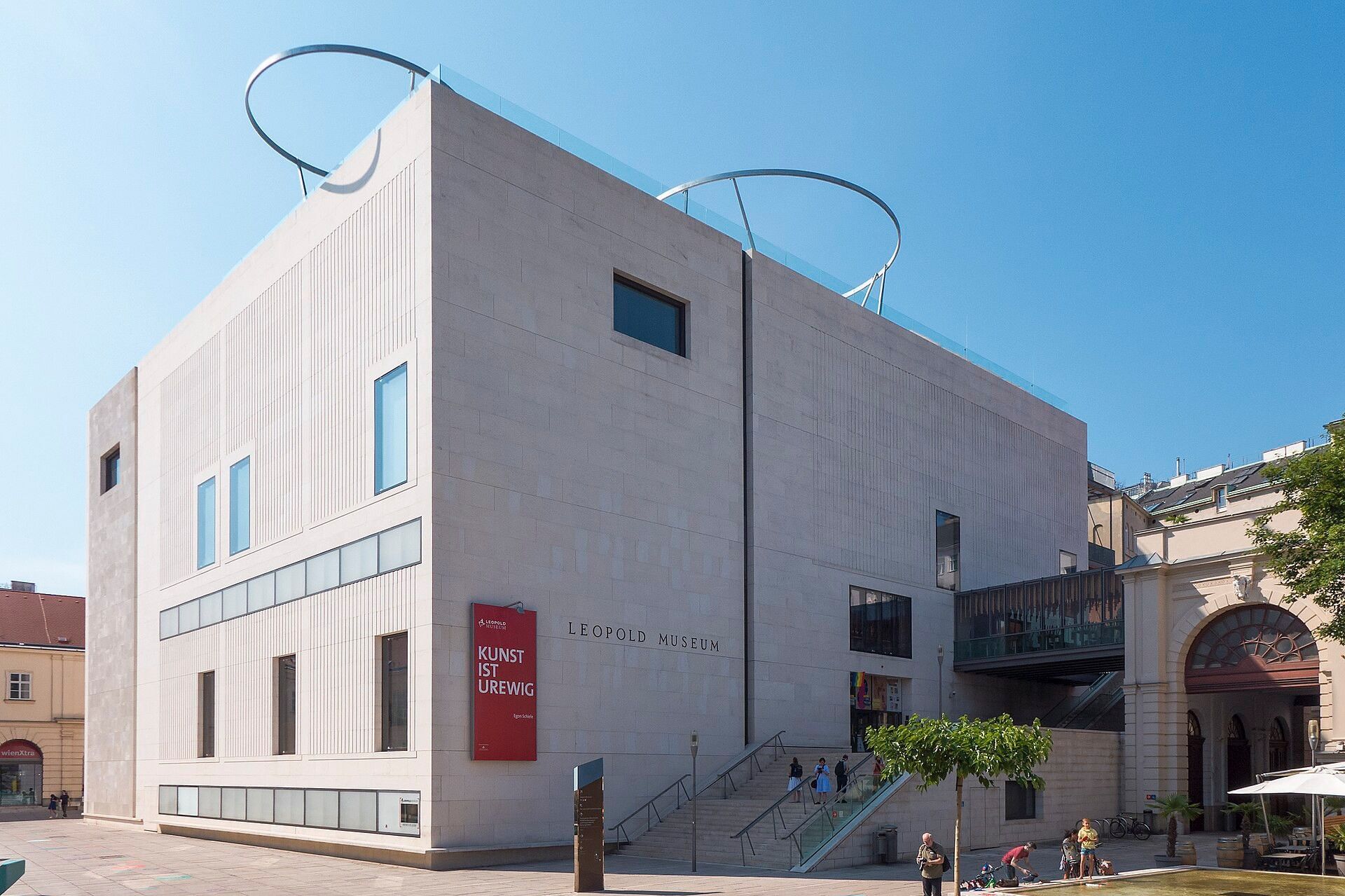 Exterior view of the Leopold Museum in Vienna’s MuseumsQuartier featuring modern architecture, entrance stairs and open plaza area