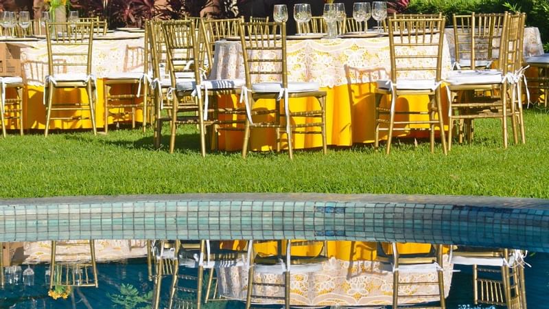 Outdoor dining area by the pool at Gamma Colima Garden