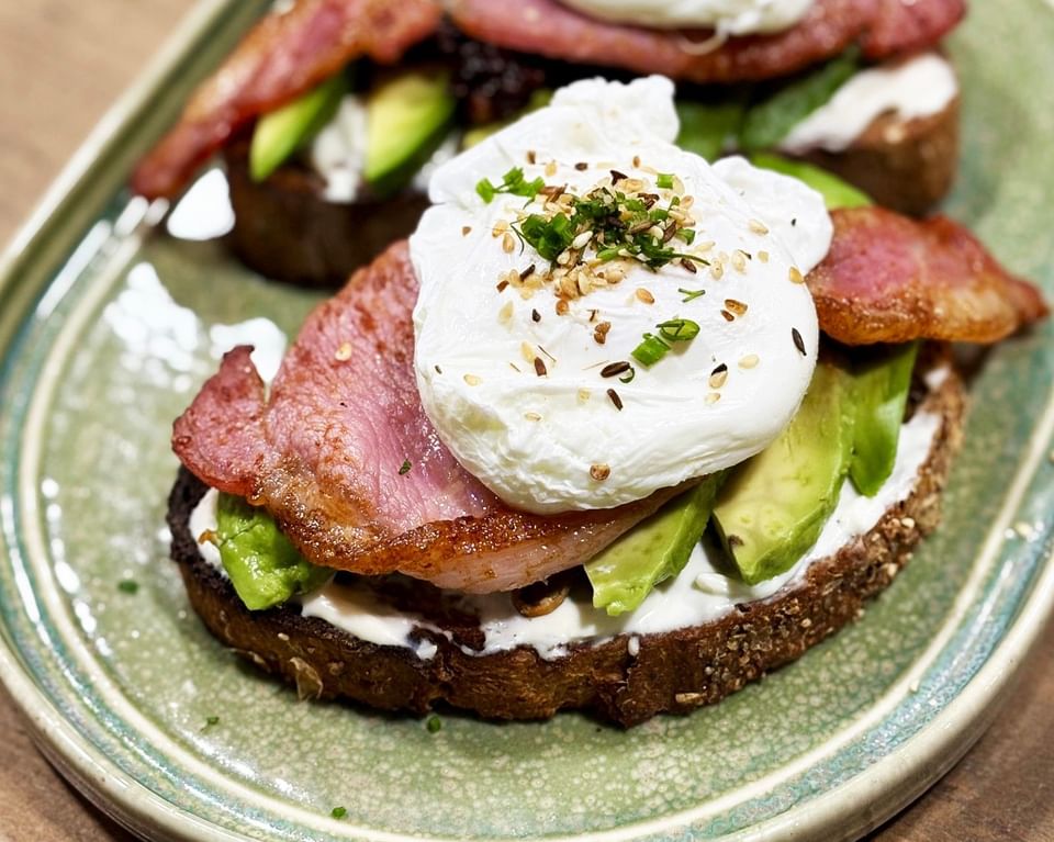 Poached egg with bacon and avocado on toast, served at Gott's Bar & Kitchen, The Met Hotel Leeds, England