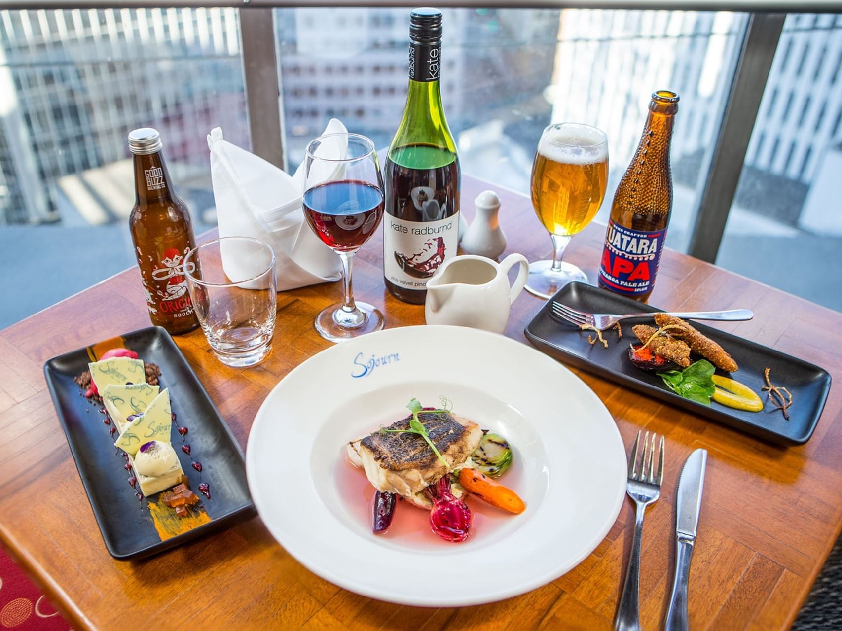 Liquor & starters served in a room with a city view at James Cook Grand Chancellor