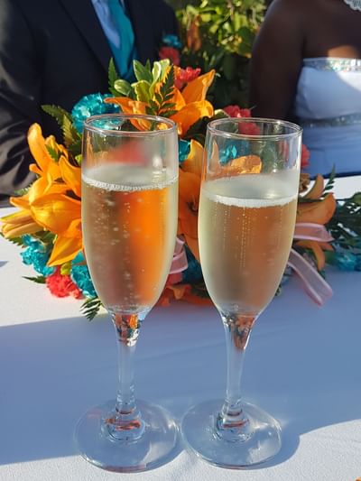Close-up of champagne glasses and flower decor at Dover Beach Hotel