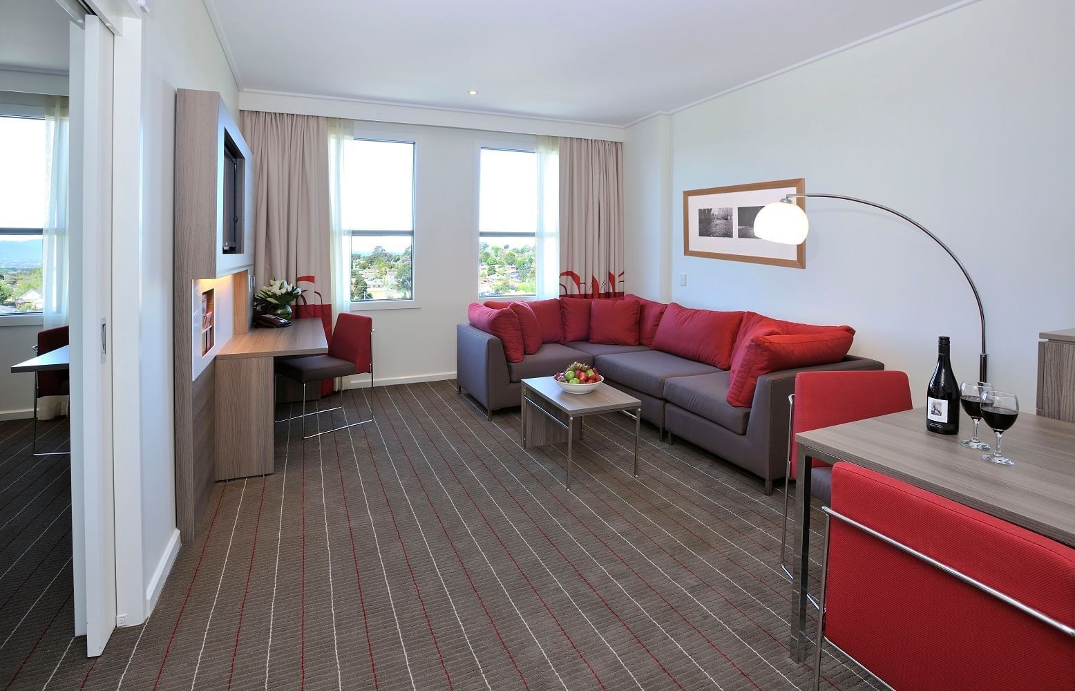 Living area of the Superior King Suite at Novotel Glen Waverley