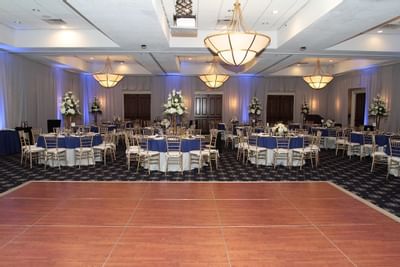Banquet tables arranged for an event at UMass Lowell Inn