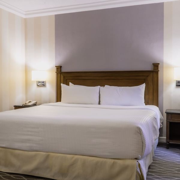 Large bed in the Executive King Room at Gamma Hotels