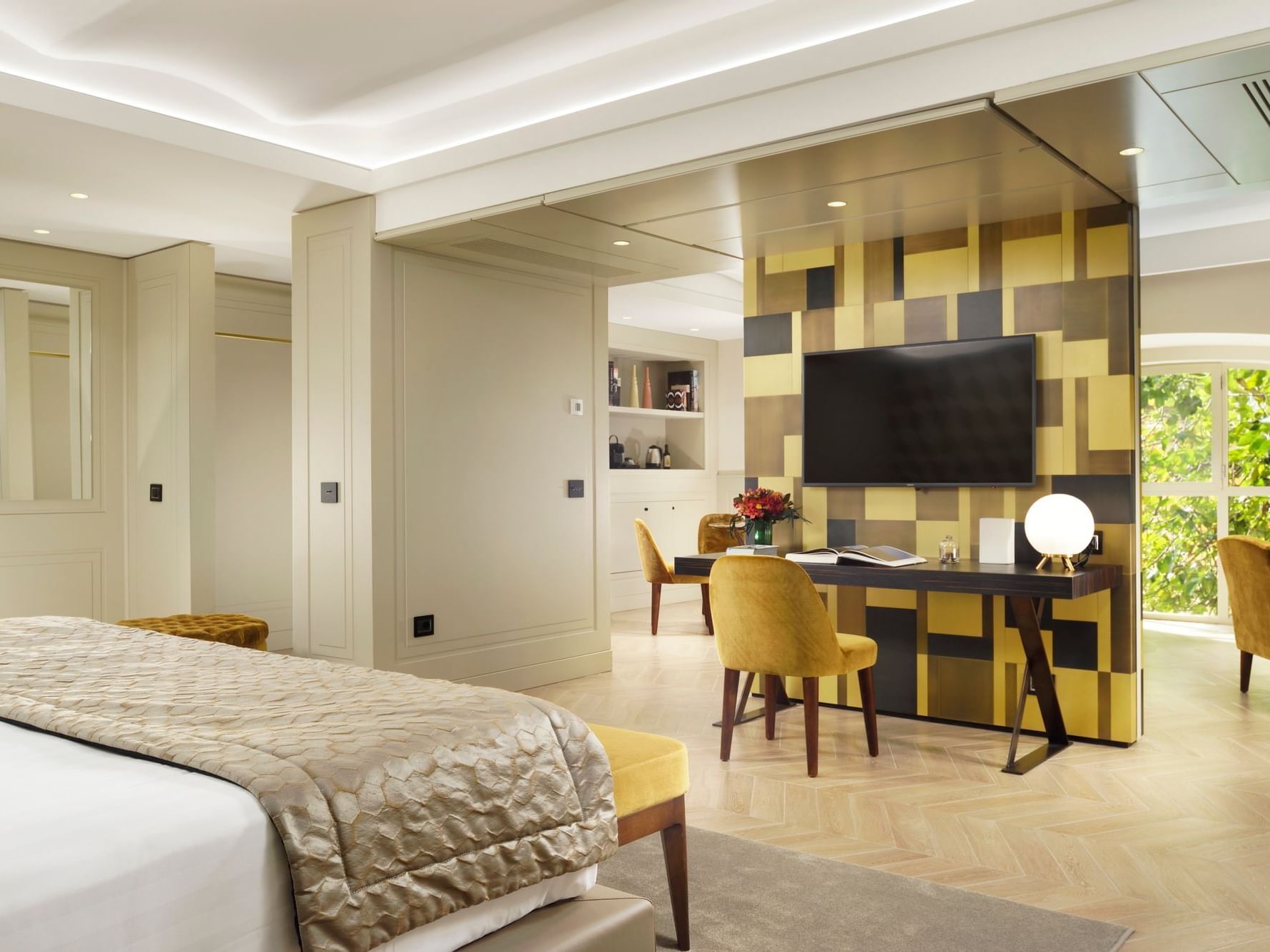 Cozy bed and working desk with TV in Margutta Suite at Margutta 54