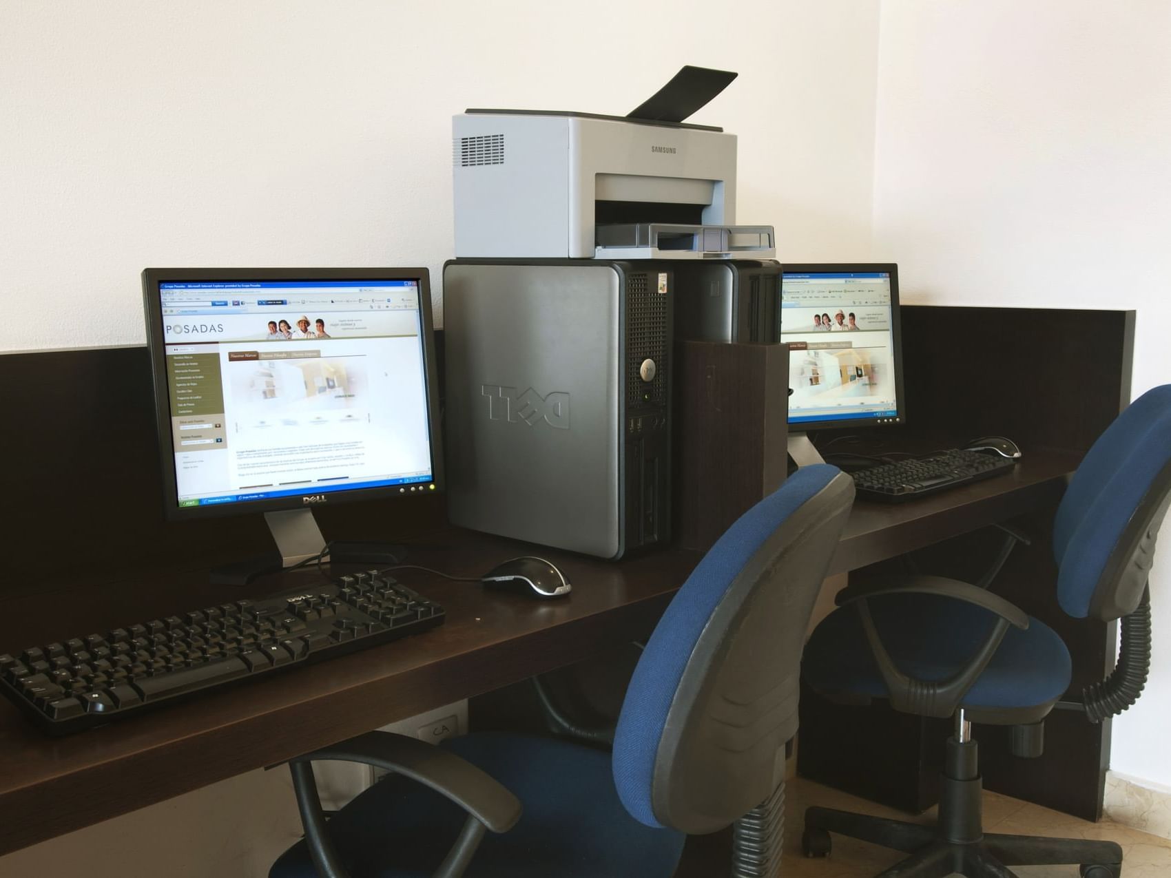 Close-up of workstations with a printer machine at One Hotels