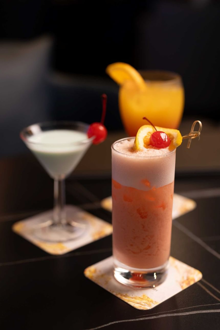 Close-up of three cocktails on a counter in Marigold Bar at Park Hotel Hong Kong