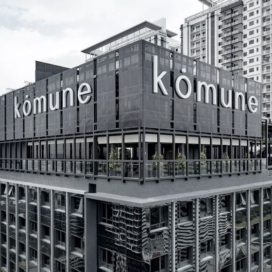 Old portrait of the exterior view of Komune hotel façade