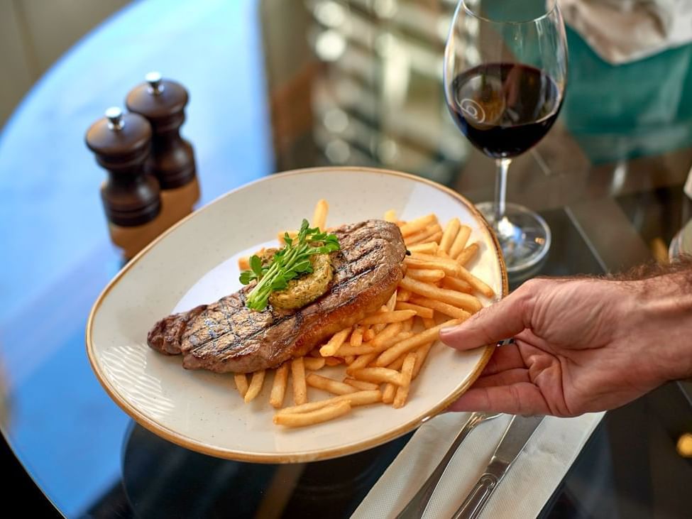 Steak with fries served at The Sebel Quay West Suites Sydney