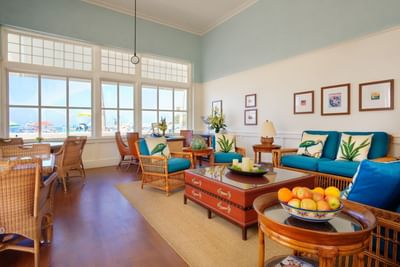 Comfy lounge & dining area with wooden floors & a sea view at Catalina Island Company