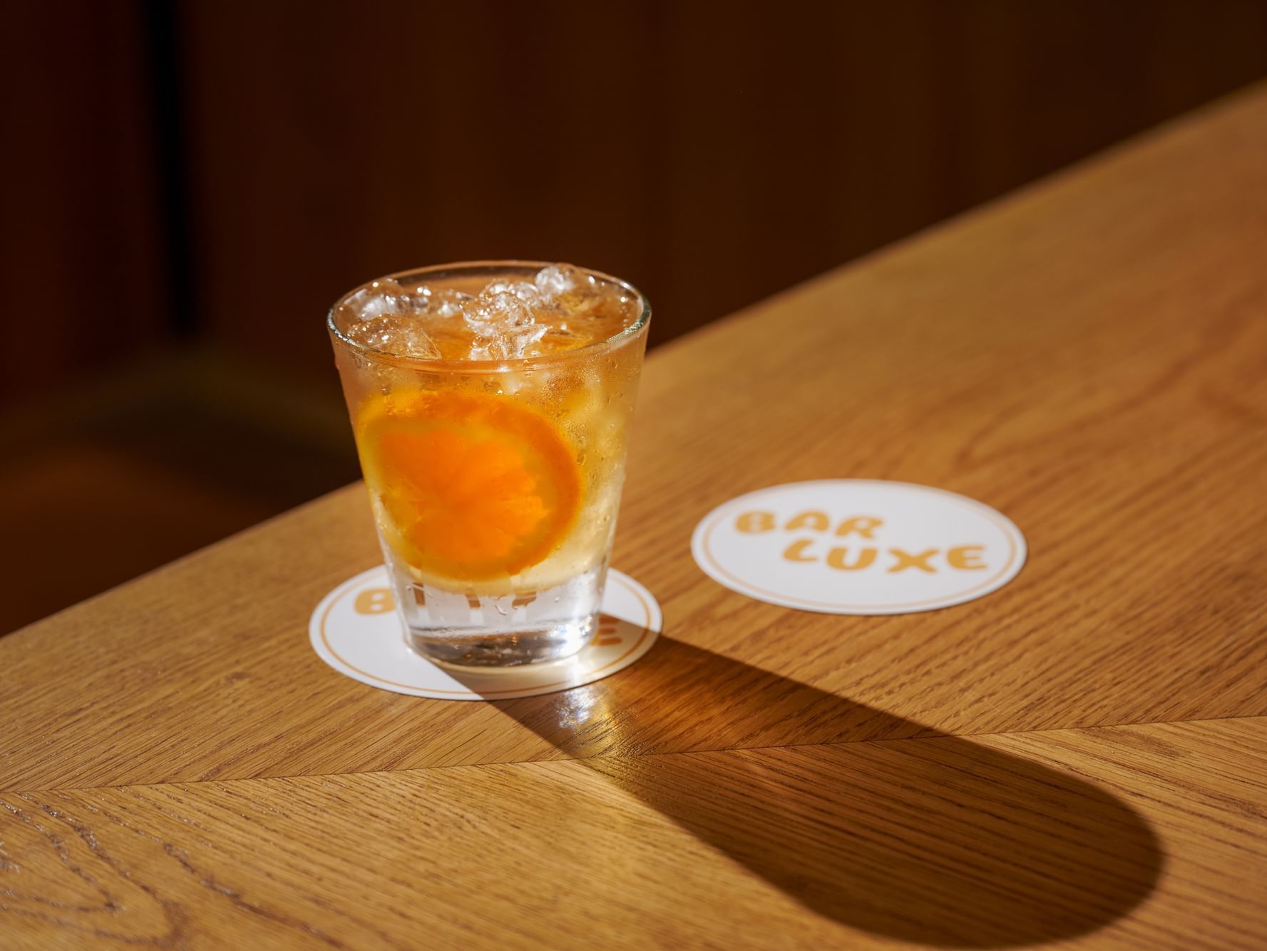 Serving a cocktail in the bar counter at Luxe Sunset Boulevard