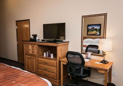 Tv and working desk in a room at Marv Herzog Hotel