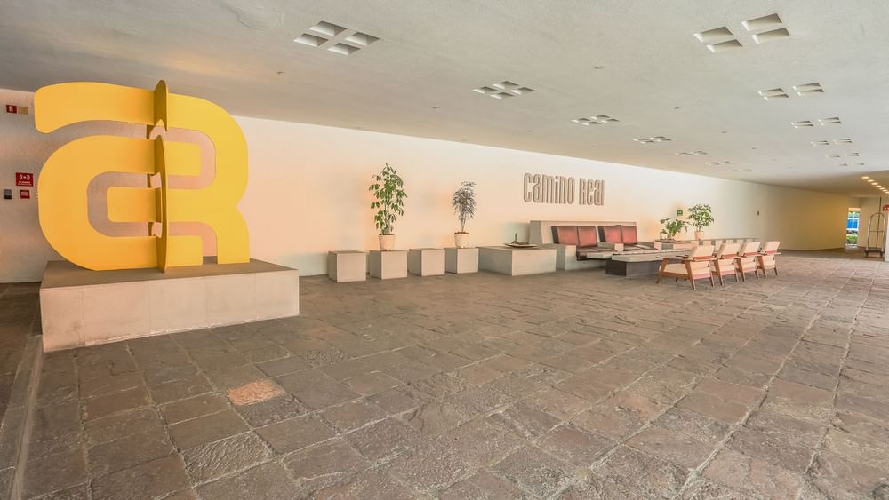 Iconic yellow sculpture at Camino Real Polanco Mexico entrance, featuring the hotel's famous architecture