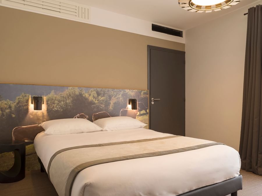 Double room with king size bed at The Originals Hotels