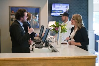 Front desk agent providing friendly service at the front desk at Rodd Grand Yarmouth, one of the best hotels in Yarmouth