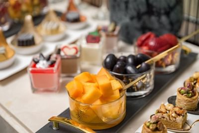 Close-up of fruit platters served at Elaf Al Taqwa Hotel
