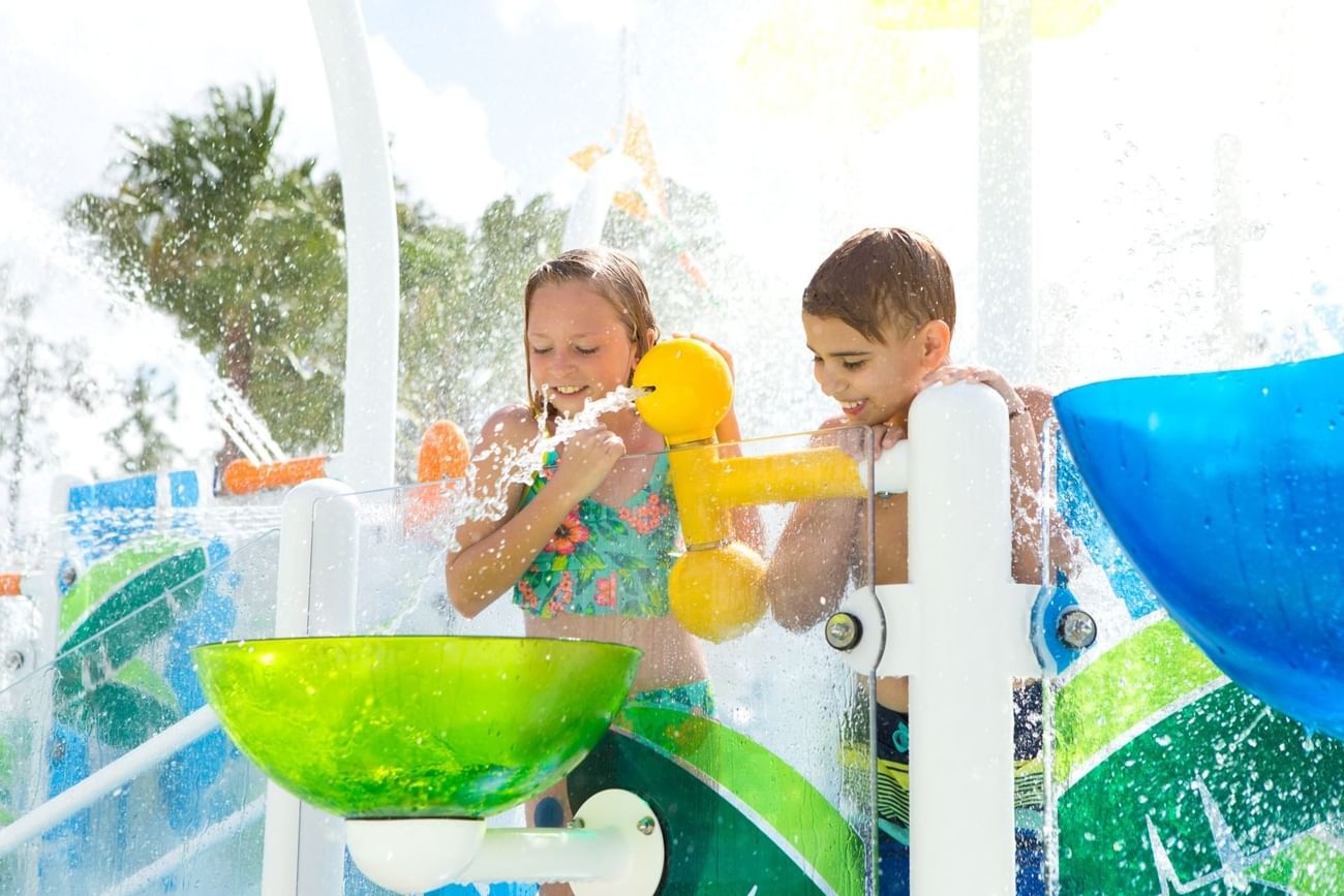 Children playing with water toys in Surfari Water Park at The Grove Resort & Water Park