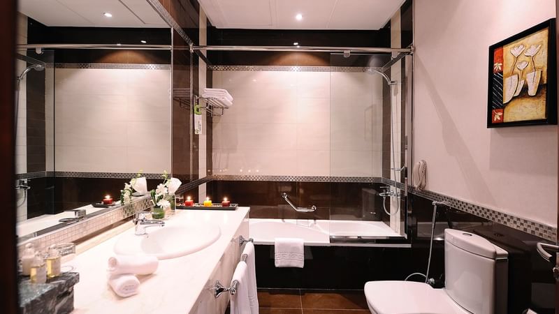 Bathroom vanity & bathtub in Junior Suite at Al Hamra Palace by Warwick Riyadhd