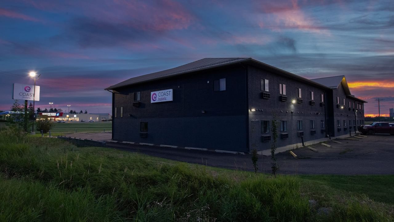 Rear exterior of Coast Innisfail Hotel at sunset