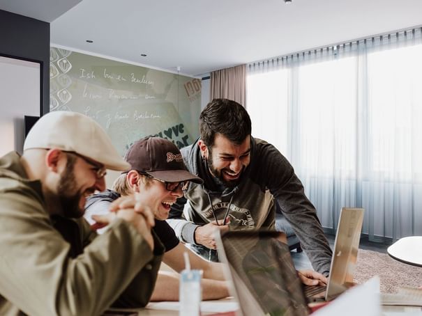Group of people smiling while meeting at Hotel Berlin Berlin