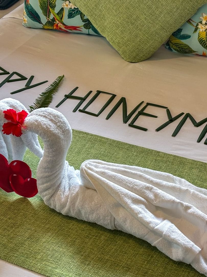 White towel swans by leaf lettering on a lime runner in Studio Villa at TokaToka Resort Nadi Fiji