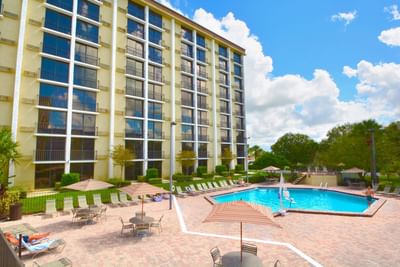 Exterior view of the outdoor pool area at Rosen Inn Hotels and Resorts