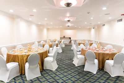 Banquet tables set-up arranged for an event at Courtleigh Hotel & Suites