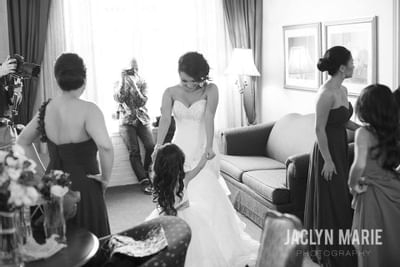 Bride and flower girl smiling in a suite Hotel at Old Town Wichita