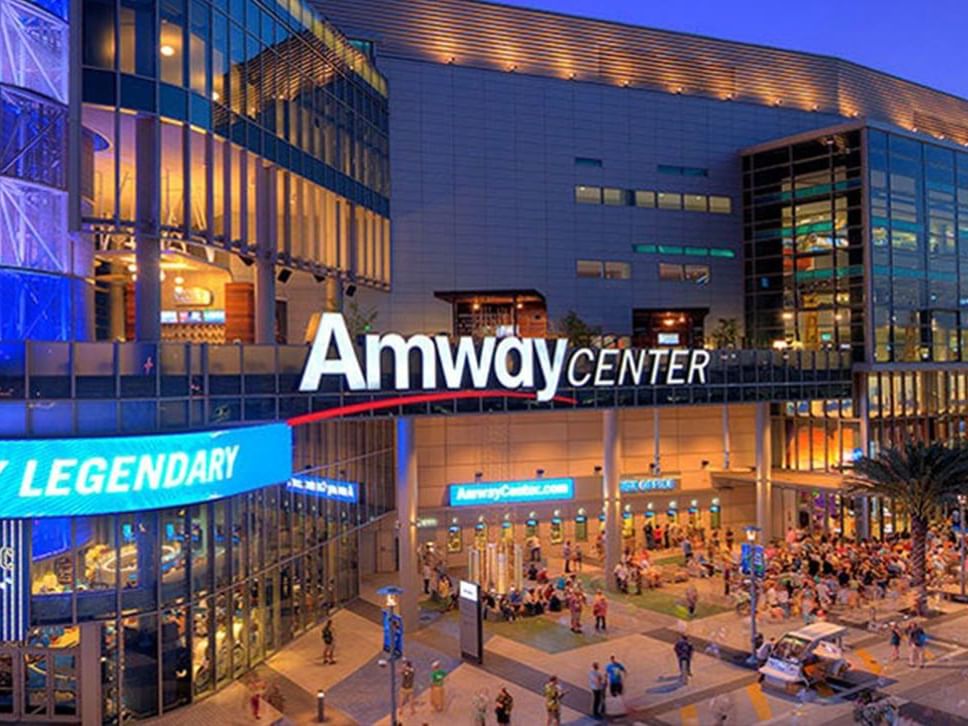 People bustling around Amway Center near Lake Buena Vista Resort Village & Spa