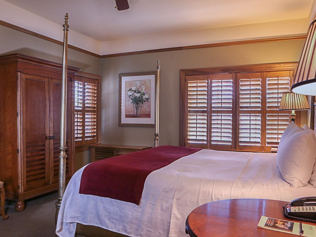 large bed and side table in a hotel room