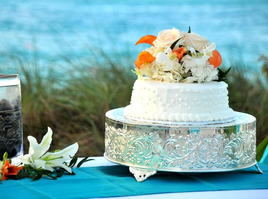 A decorated wedding cake at Windsong Resort On The Reef
