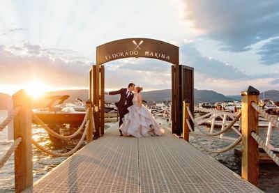 Couple kissing together near Manteo Resort Waterfront