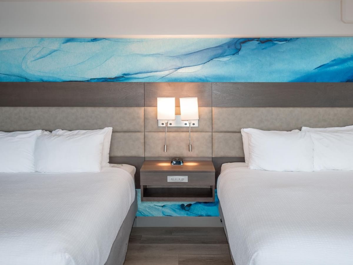 Two beds with ocean view in Coast Premium Two Queens room at Coast Bastion Hotel in Nanaimo.