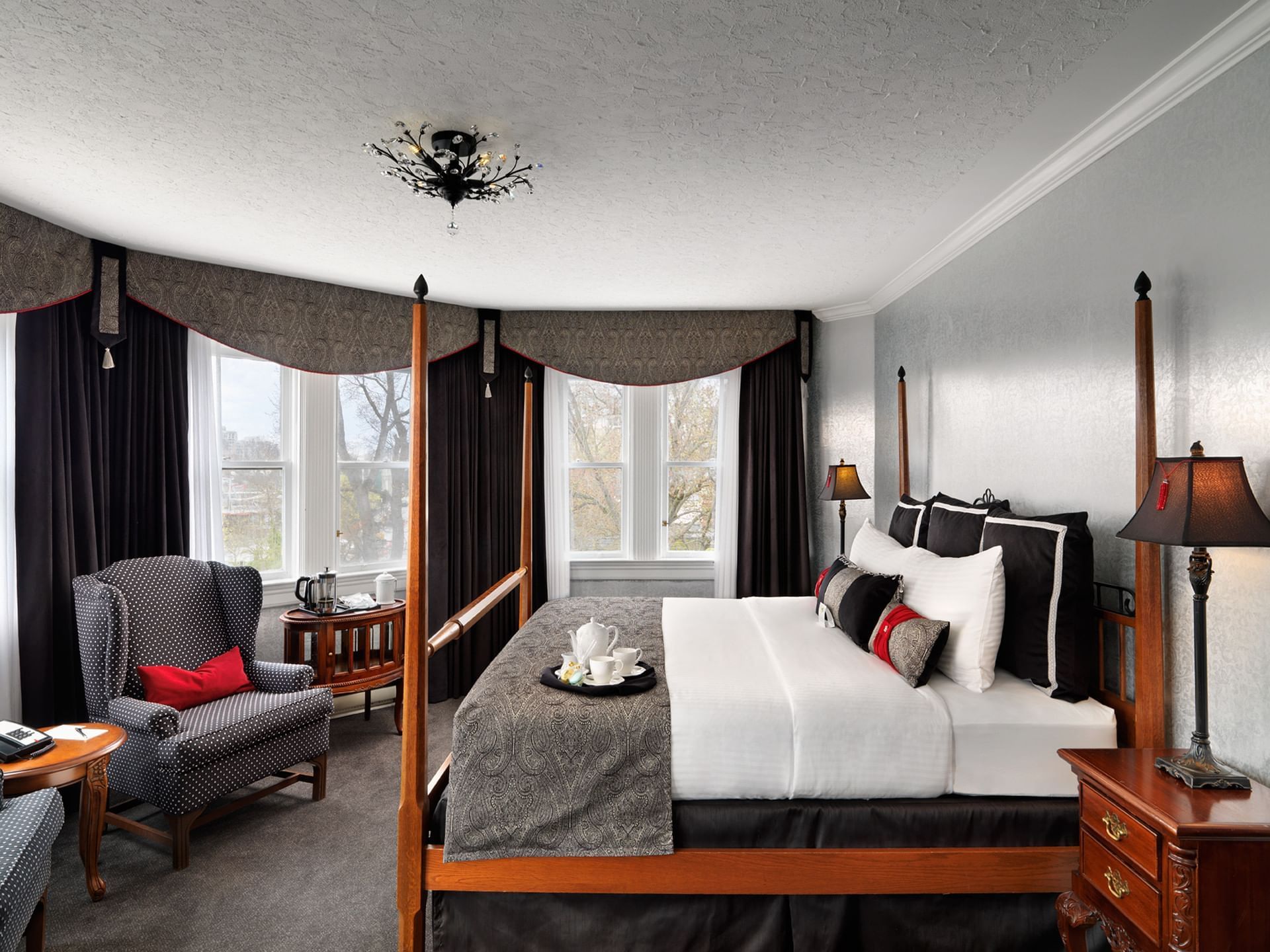 King-size bed with loungers in Harbour Room at Pendray Inn & Tea House